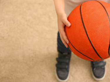 Child holding a basketball