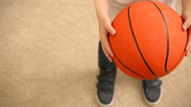 Child holding a basketball