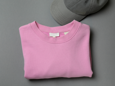 Pink shirt folded with grey hat