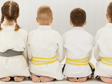 Judo group of students sitting