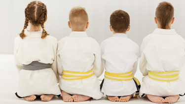 Judo group of students sitting