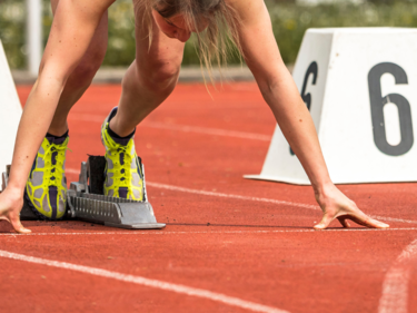 Track and Field student beginning a race