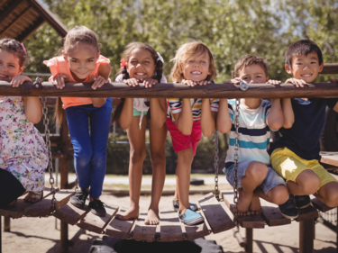 Students on a bridge in a playground