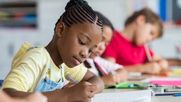 Elementary Kids writing in class