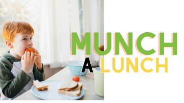 child with red hair eating lunch