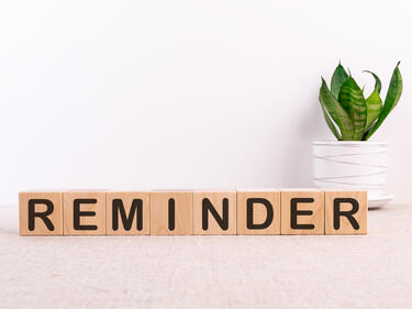 Reminder sign on wooden blocks