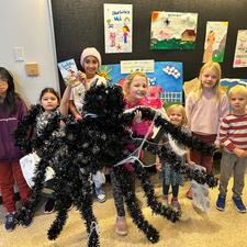 Students gathered around the Charlotte's Web display