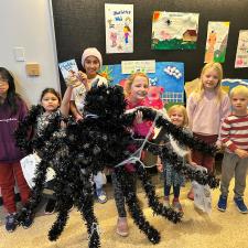 Students gathered around the Charlotte's Web display